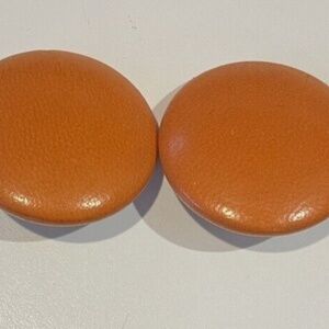 Vintage Charles Jourdan orange leather clip earrings